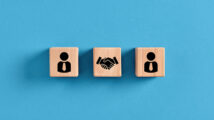 Business deal, agreement or contract concept. Employee manager and handshake icons on wooden cubes