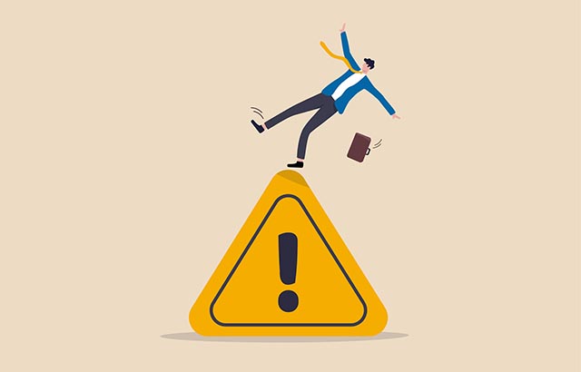 Mistake caution, business risk or problem warning, failure prevention or avoid danger concept, cautious businessman slip falling on exclamation symbol beware, careful caution sign.