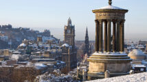 Edinburgh City and Castle viewed from Calton Hill on a beautiful winter morning with the Dugald Stewart monument in the foreground and the castle, Scott monument and Balmoral clock tower in the background.