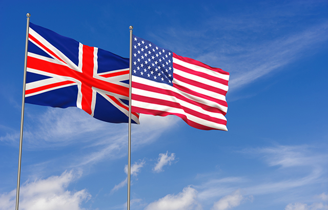 United Kingdom and USA flags over blue sky background. 3D illustration